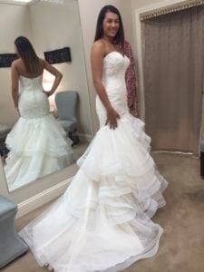 Strapless fit-to-flare style wedding dress with tiered flared skirt