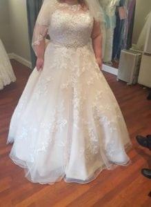 Plus size lace wedding gown with belt from Darius Bridal