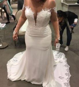 sheer long sleeve wedding dress with lace hem train
