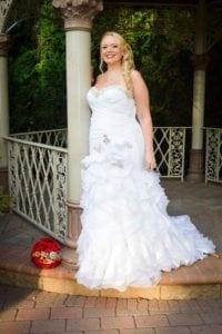 strapless plus size wedding gown with ruffled skirt