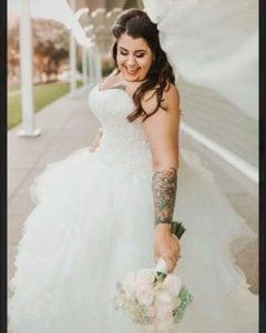 Strapless plus size wedding gown with tulle ruffled skirt from Darius Bridal