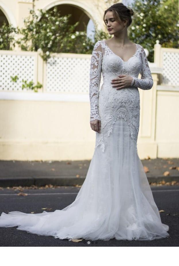 Long sleeve nude and ivory lace wedding dress from Darius Bridal