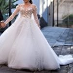 Sheer long sleeve ball gown wedding dress