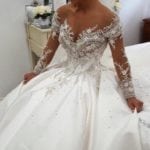 Off the shoulder long sleeve beaded bridal gown