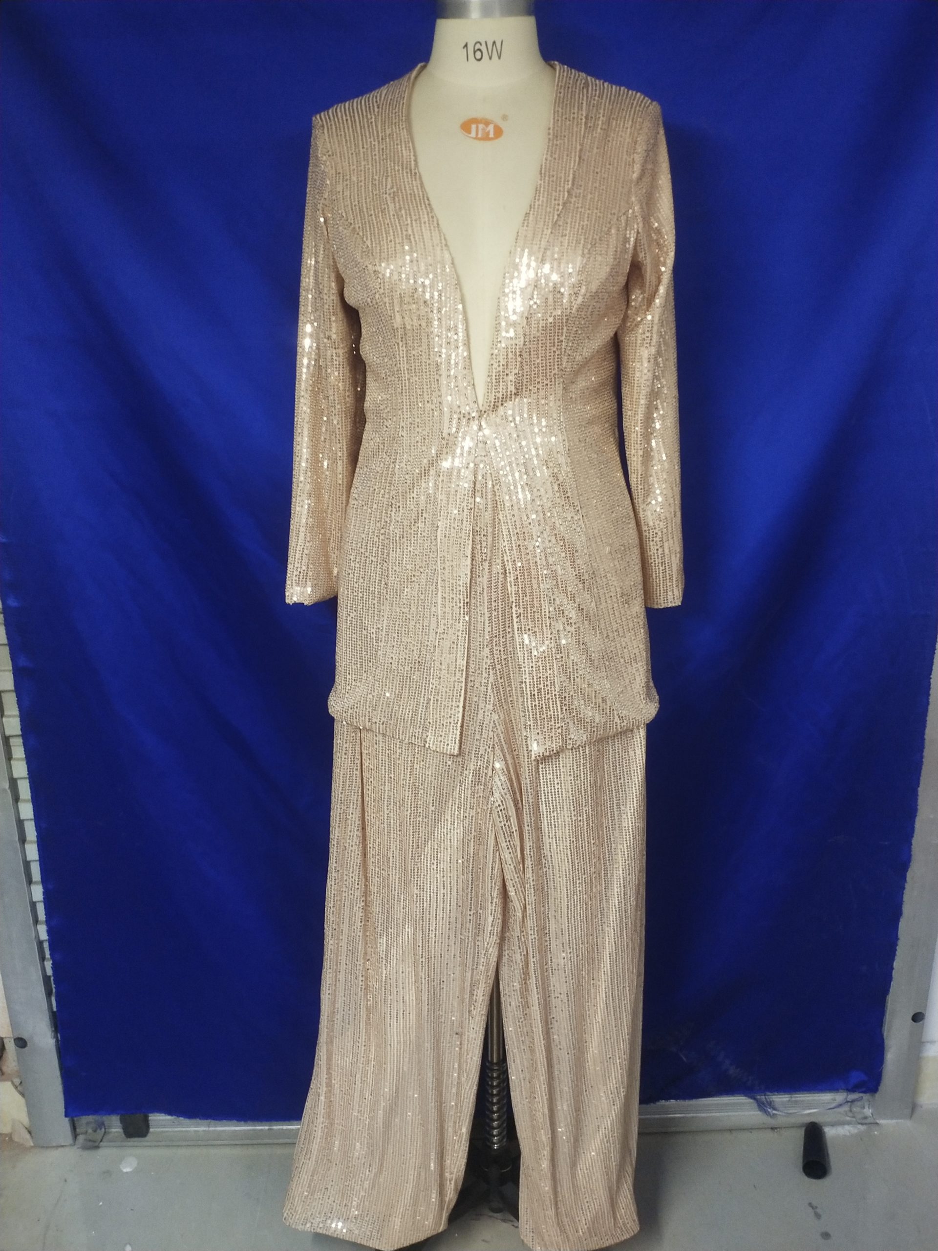 Long sleeve two piece sequin pant suit by Darius Cordell