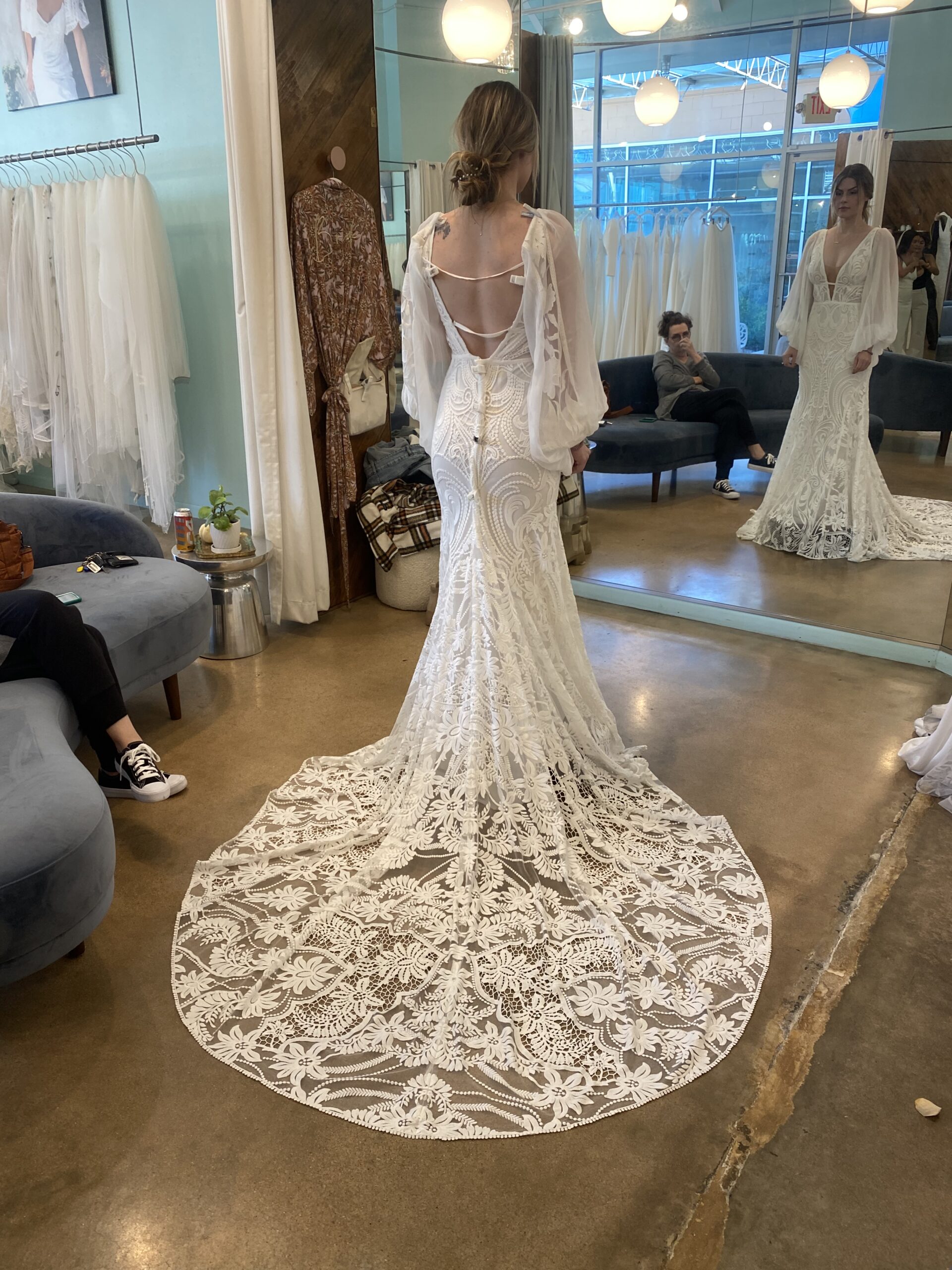 Backless long bishop sleeve wedding gown with embroidery and cathedral train