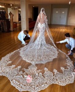 haute couture lace wedding gown with cathedral veil