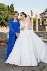 Victoria Swarovski with blue mother of the bride dress